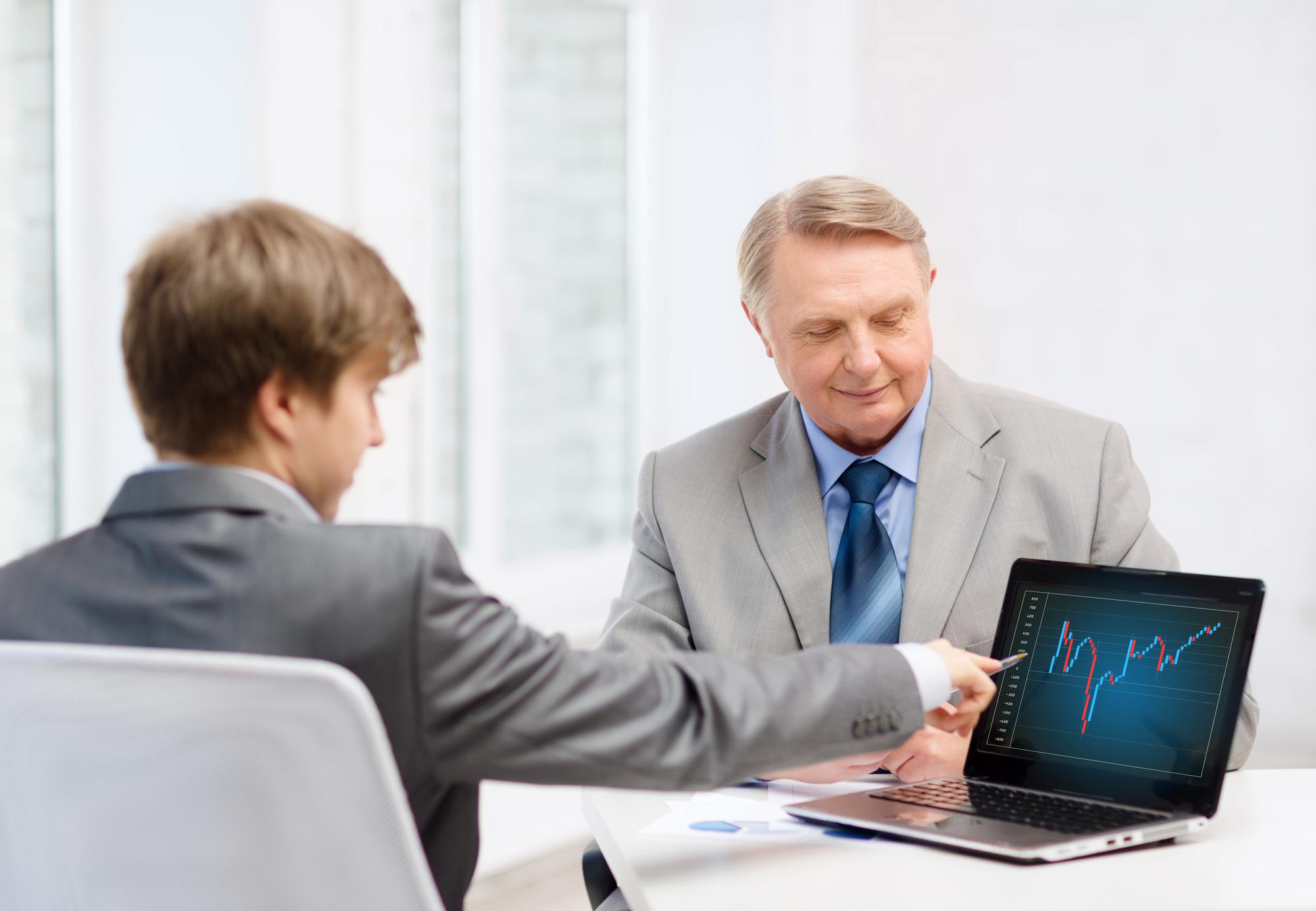 Advisor meeting with client over portfolio